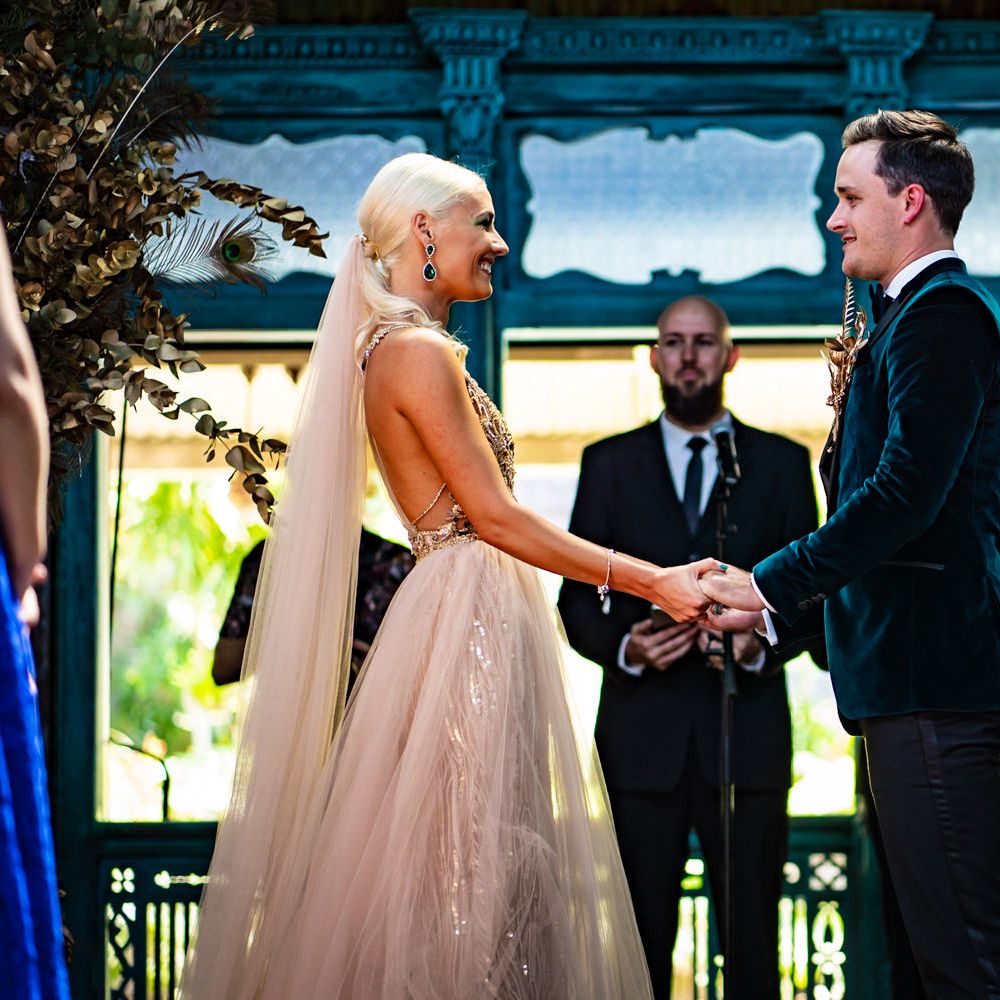 White and gold wedding dress for bride at ceremony in South Africa