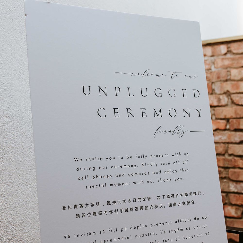 Plain black and white minimal unplugged wedding ceremony sign