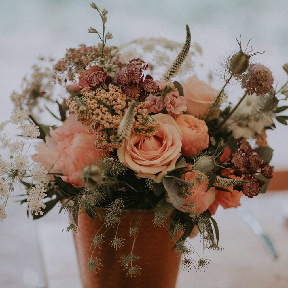 Potted flower arrangement with pink roses and pink peonies for outdoor wedding at Lila's Wood 
