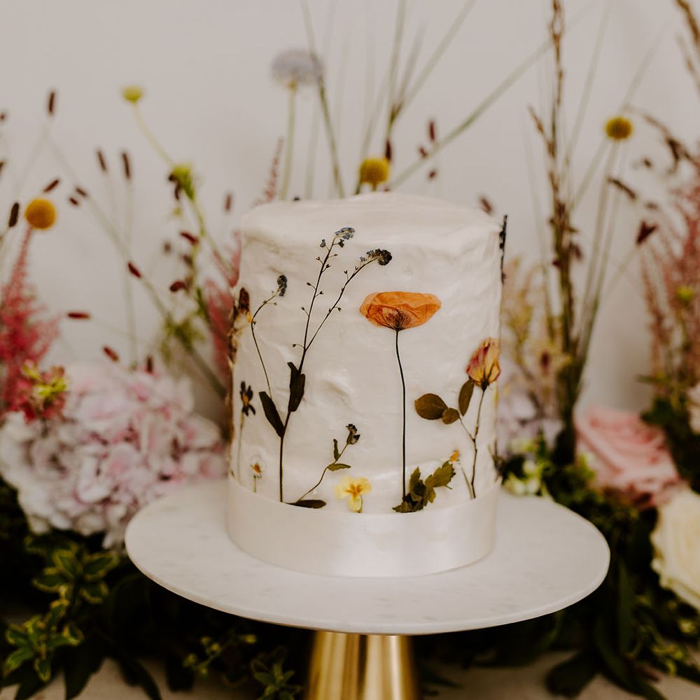 Wildflower pressed wedding cake with white icing 