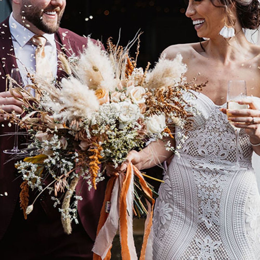 Confetti moment for bride and groom at Low Hall The Lakes wedding venue in the Lake District 