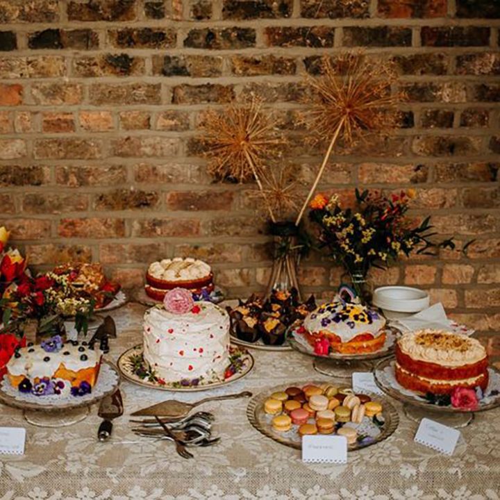 Wedding dessert tables with homemade wedding cakes including red velvet cakes, chocolate cake, macarons and more 