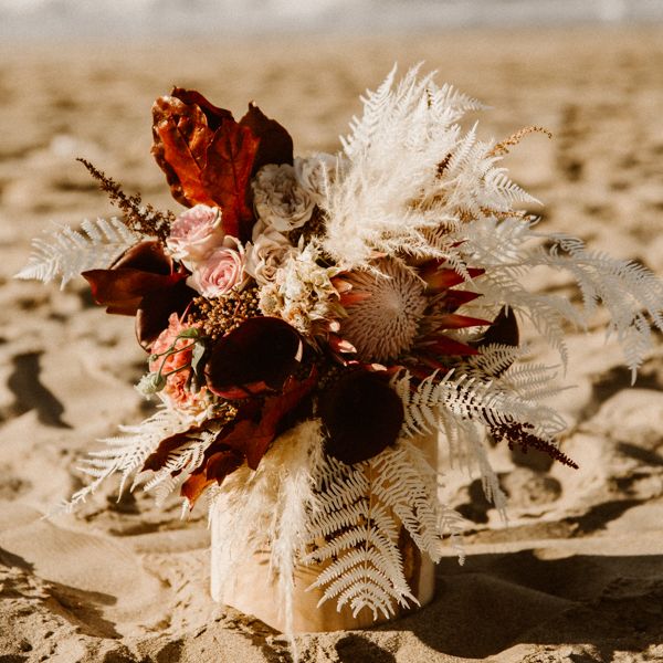 Wedding floral decor with pink roses and white ferns