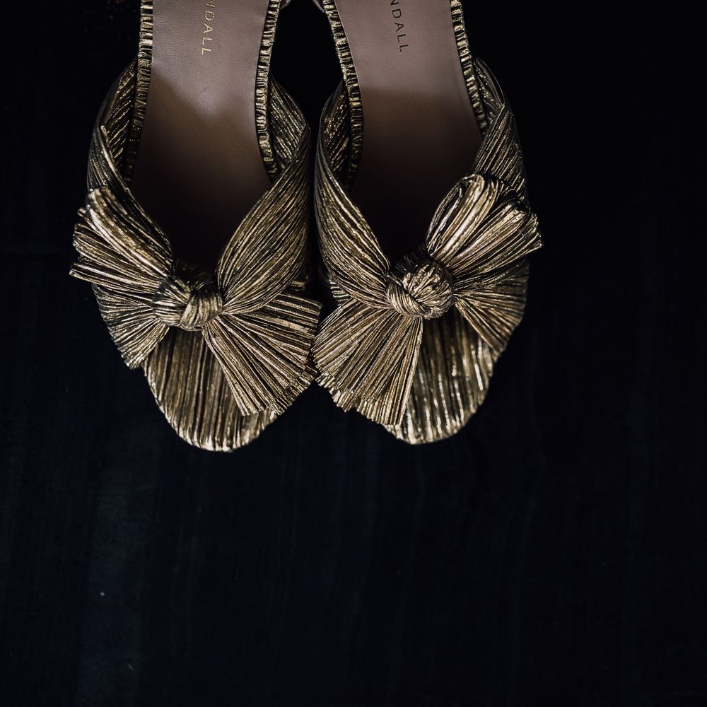 Gold Loeffler Randal heels with bow detailing for Cornwall wedding with Halfpenny London Mayfair dress