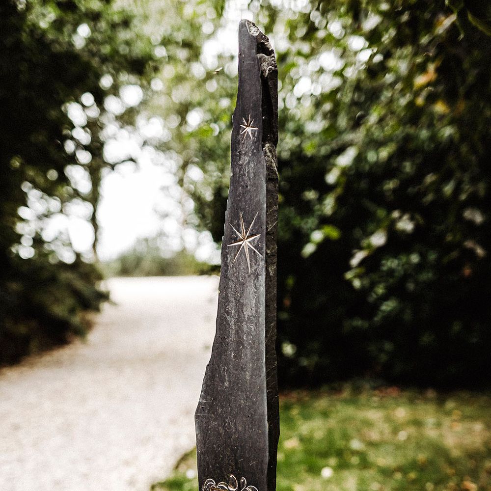 Treseren entrance with engraving on rock