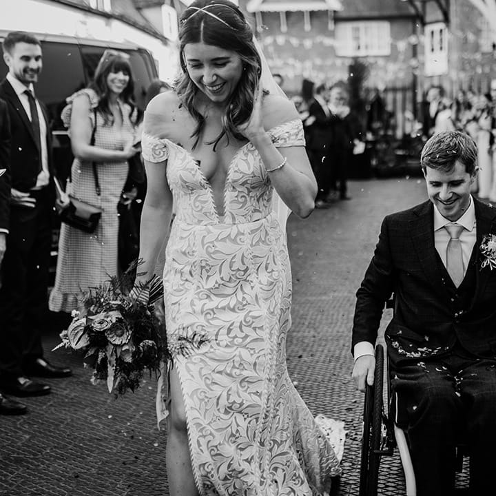 Bride and groom exit their wedding ceremony to confetti for their Henley Brewery wedding