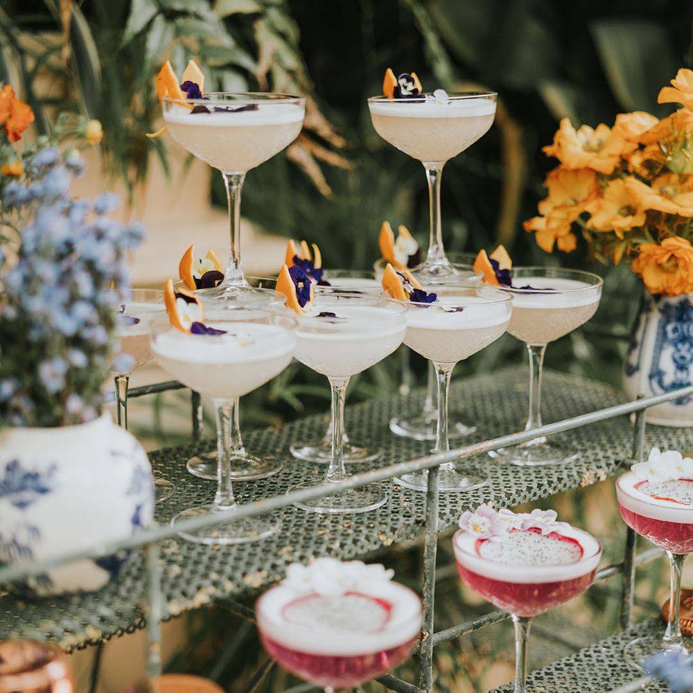 Closeup of the colourful wedding cocktail drinks on display 