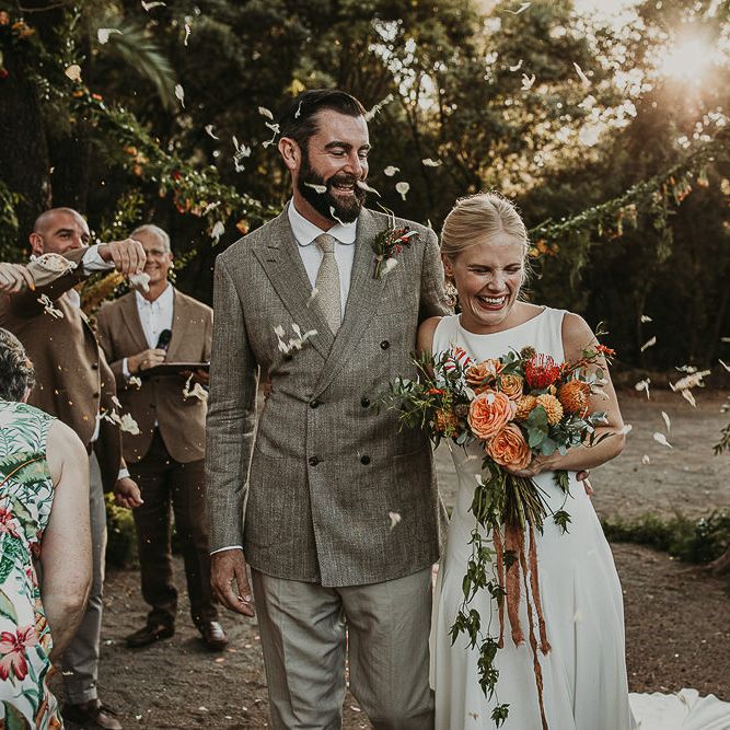 Bride and groom descending up the aisle as husband and wife