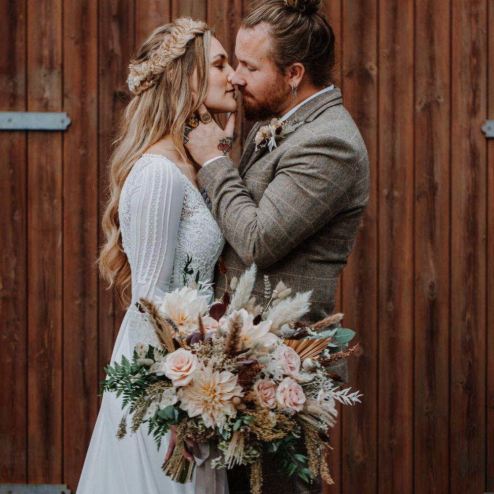 Boho luxe bride and groom photo for barn wedding 