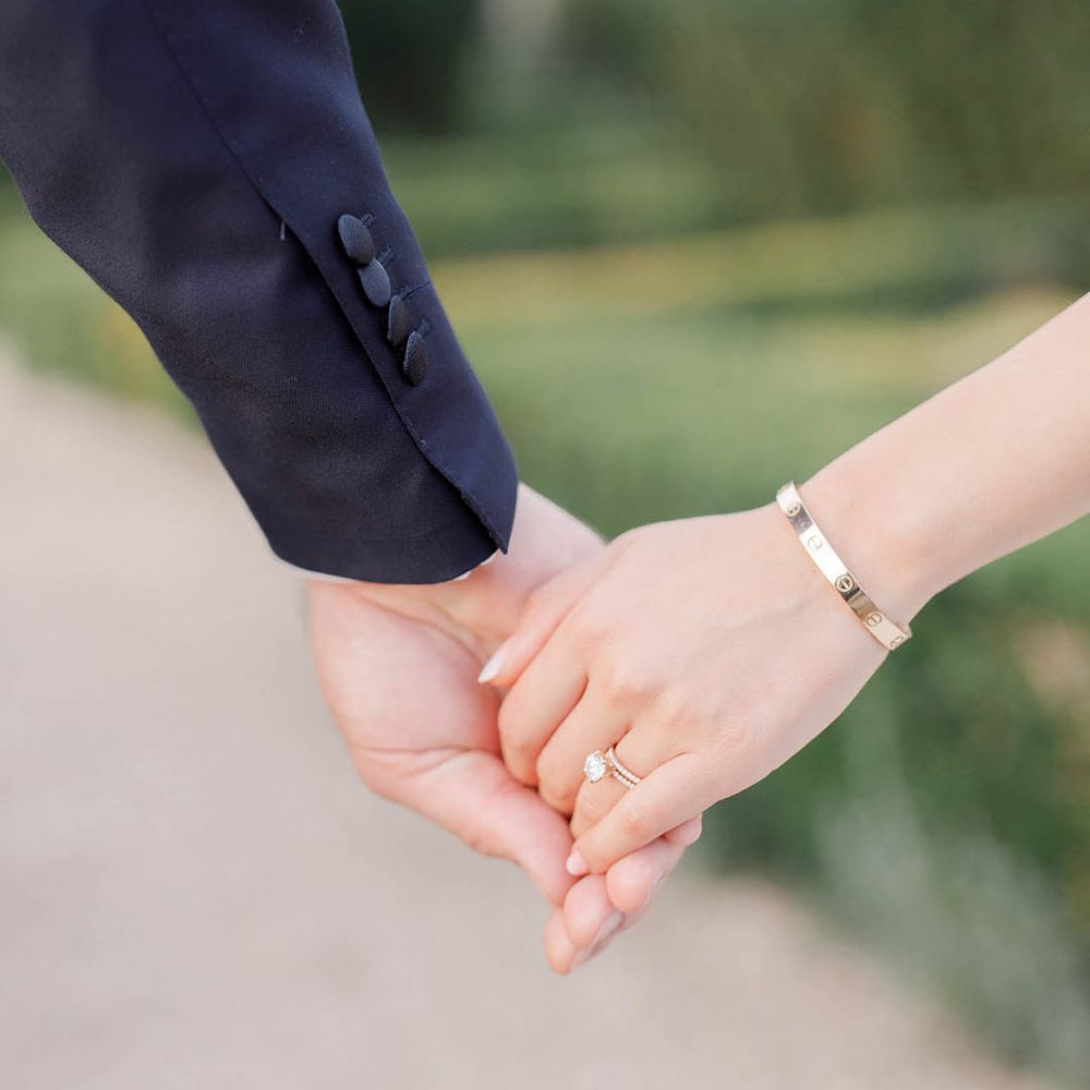 Bride & groom walk hand in hand after wedding ceremony