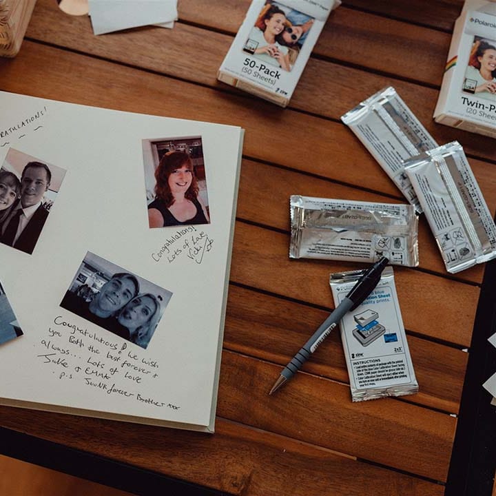Polaroid picture scrapbook for wedding guests to take pictures and write messages to the couple 