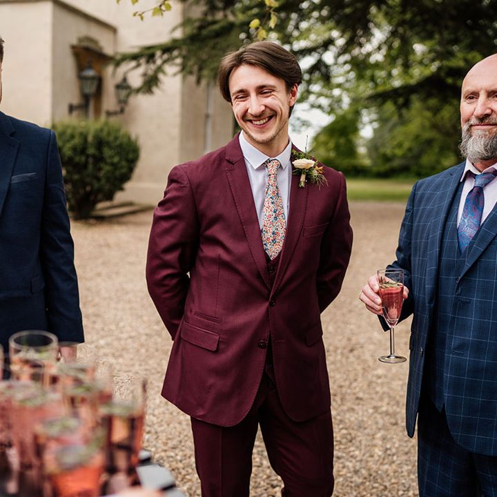 Groom with groomsmen and wedding guests getting some drinks before the ceremony 