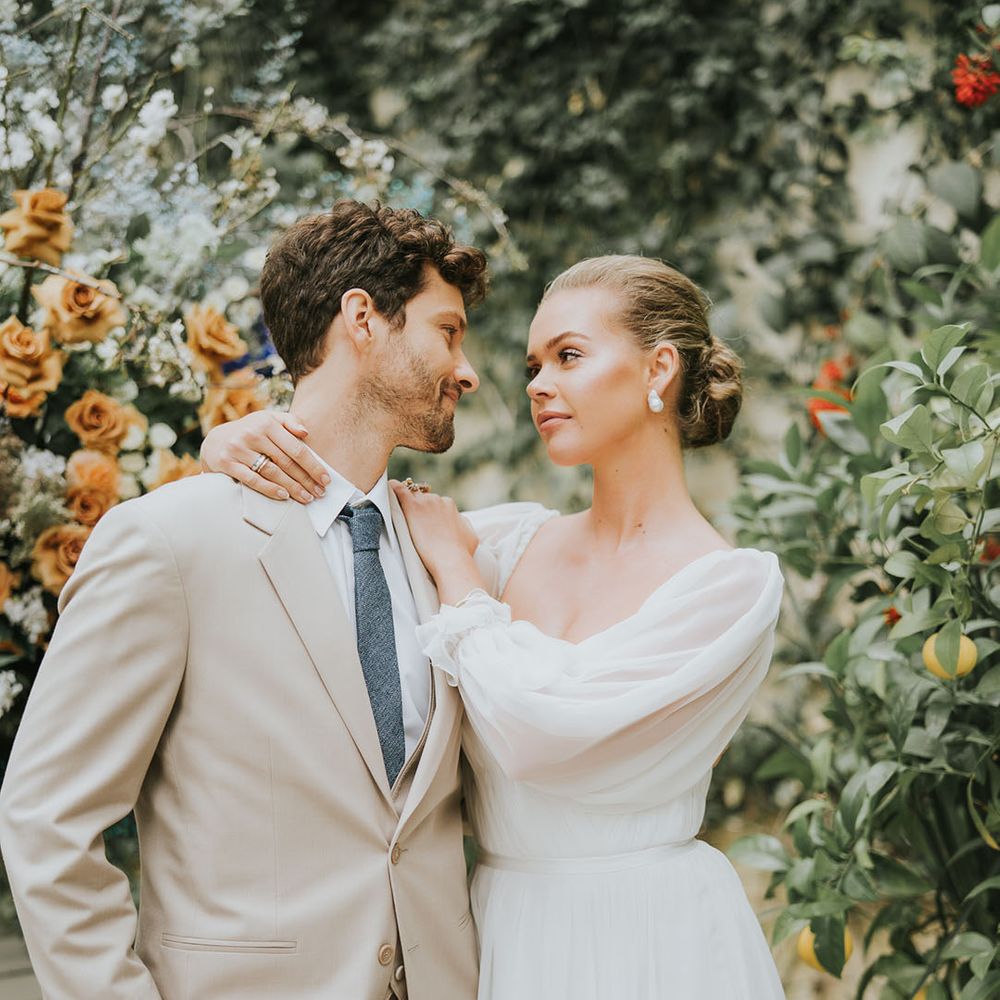 Bride and groom look into each other's eyes on their wedding day 
