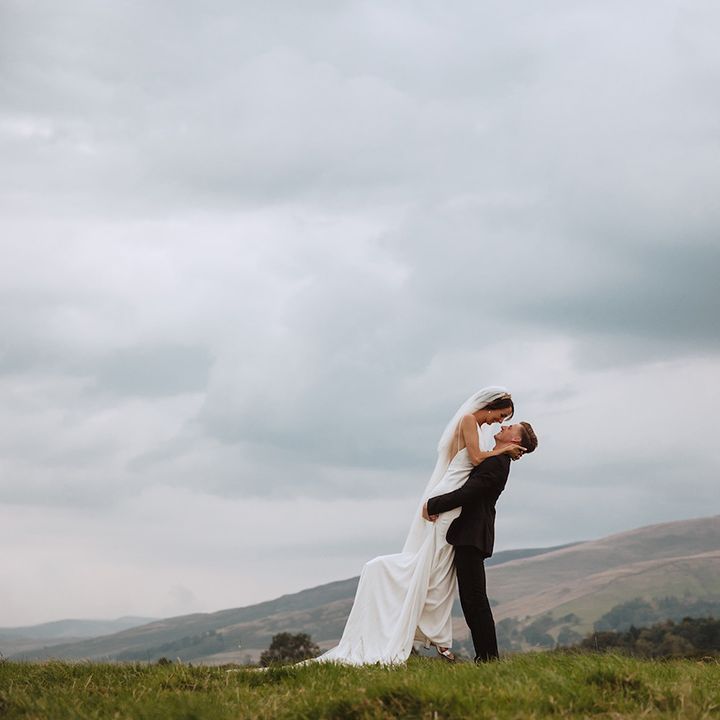 The bride and groom have romantic couple pose for wedding photos 