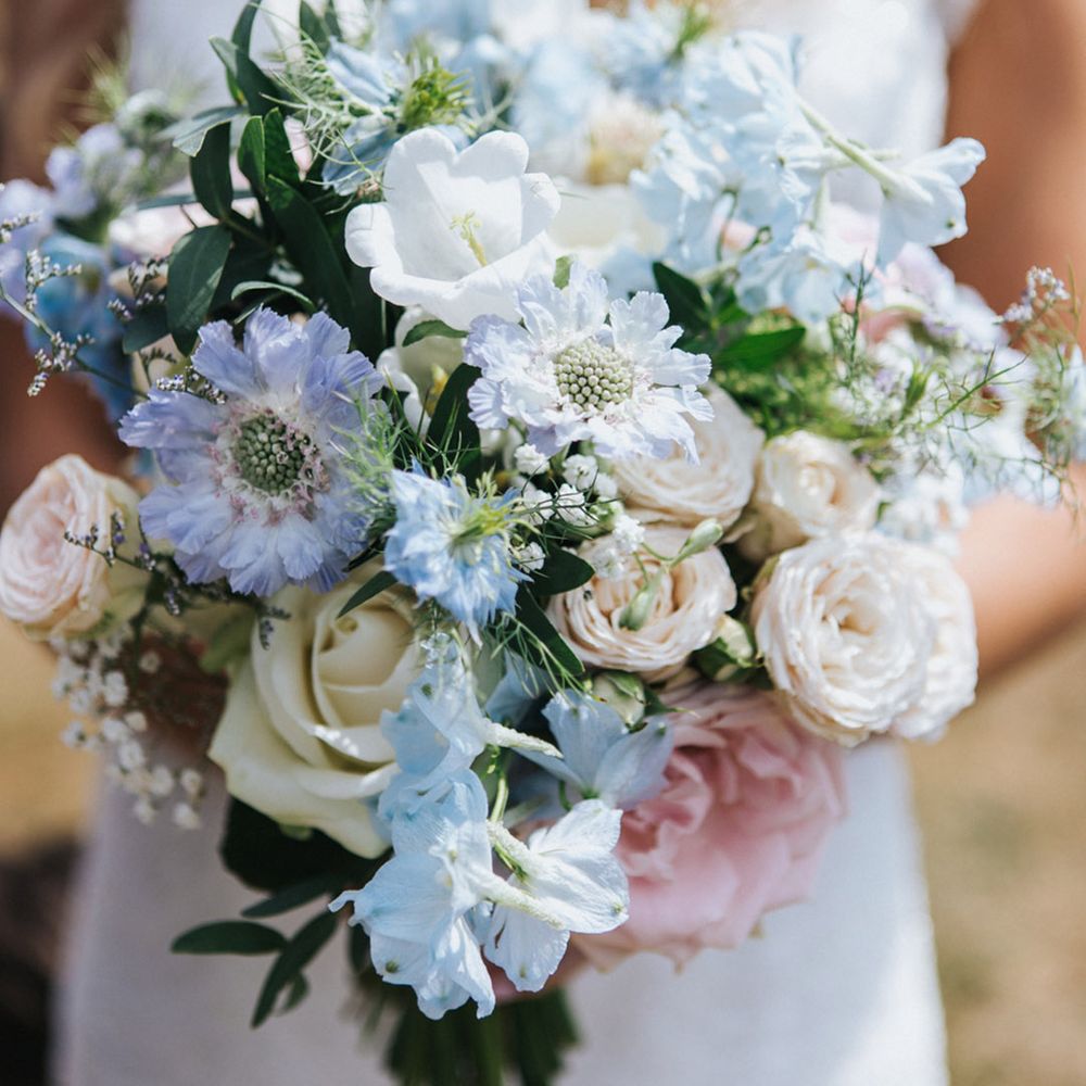 Pastel wedding theme for coastal wedding with pink, blue and white flowers 