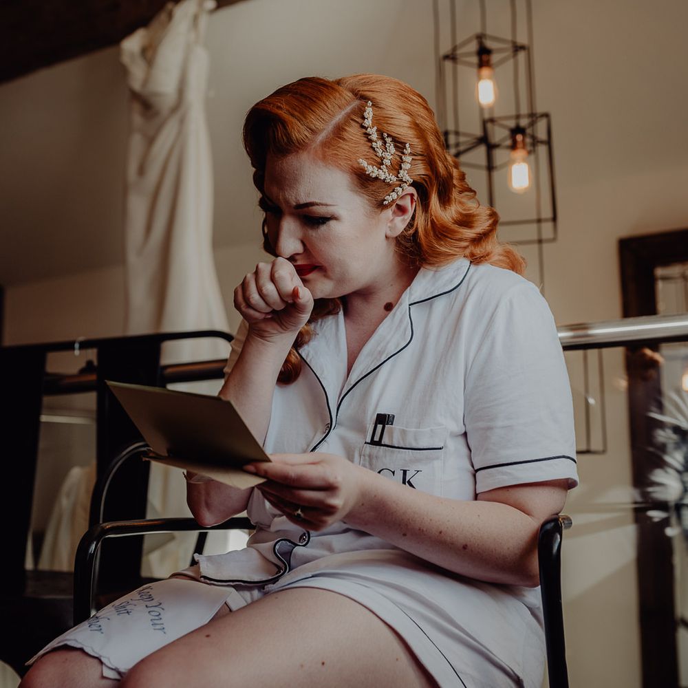 Emotional bride on the wedding morning with barrel curls 