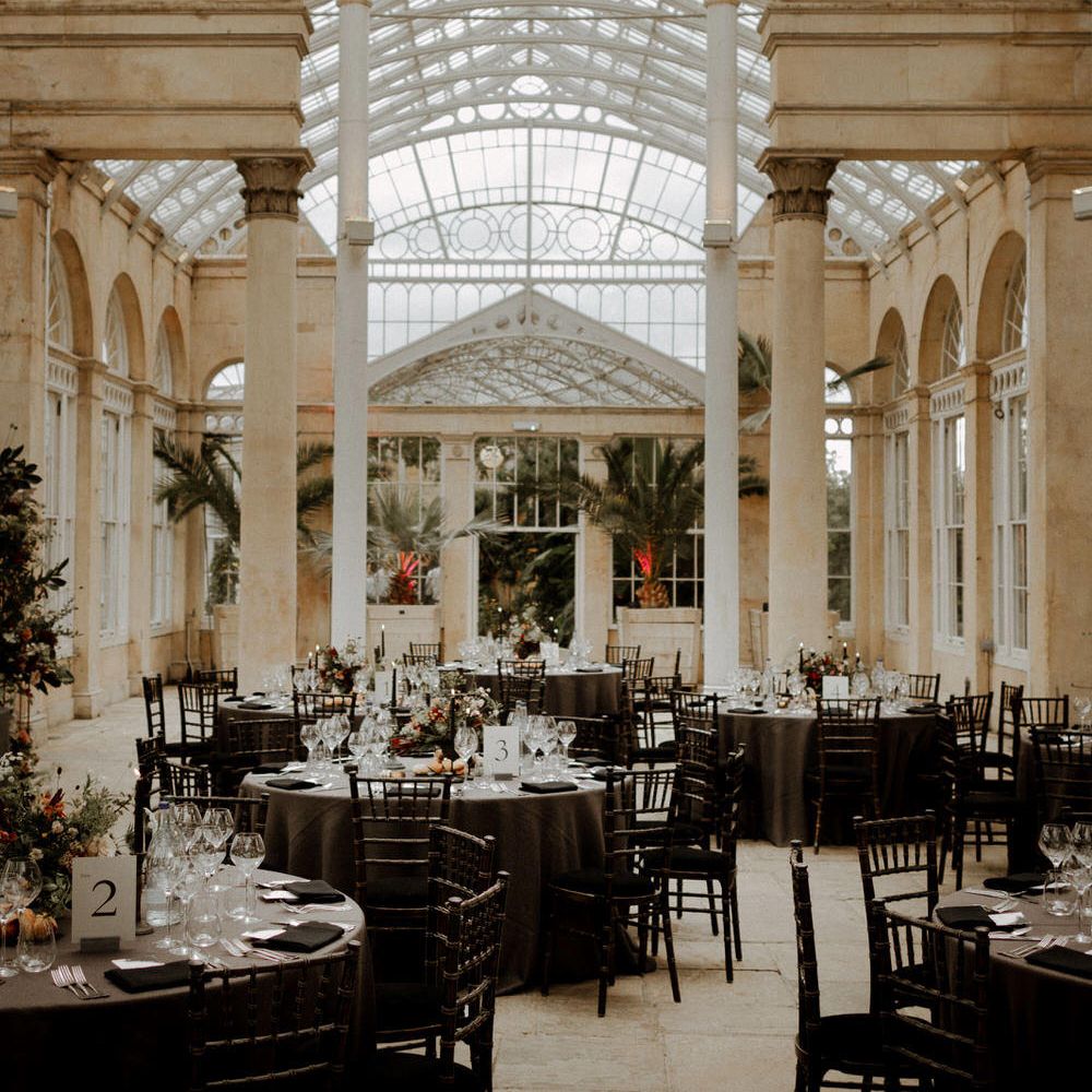 Syon Park wedding reception with dark opulent decor and autumnal flowers 