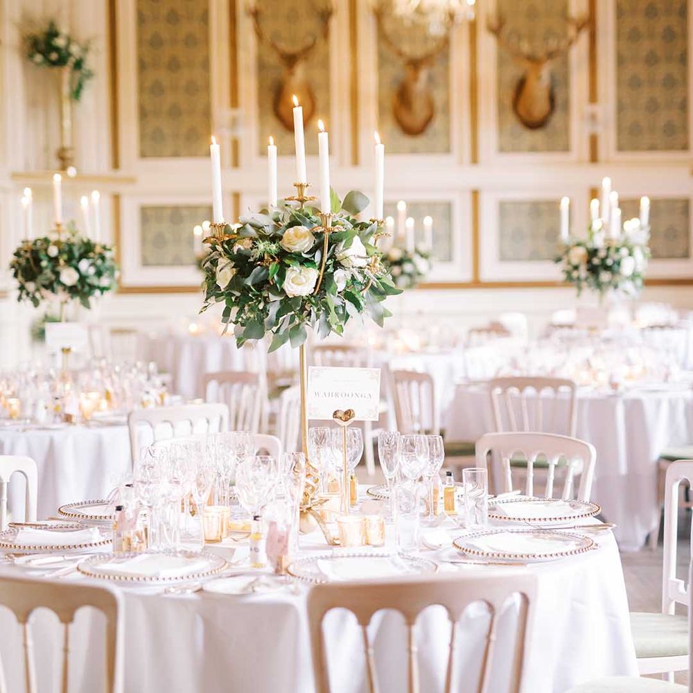 Elegant wedding reception at Drumtochty Castle with candelabra table centrepiece decor 