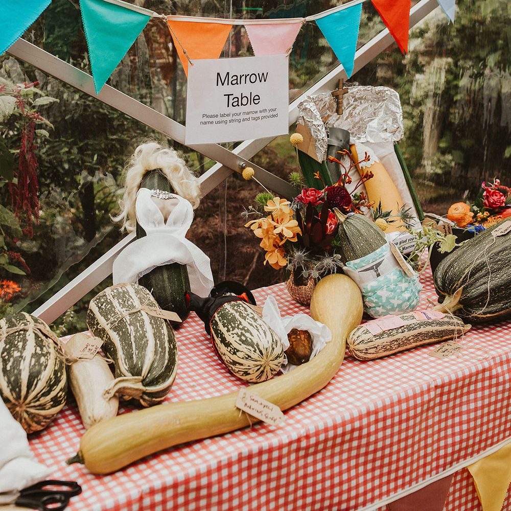 Best in marrow competition at back garden wedding with colourful bunting 