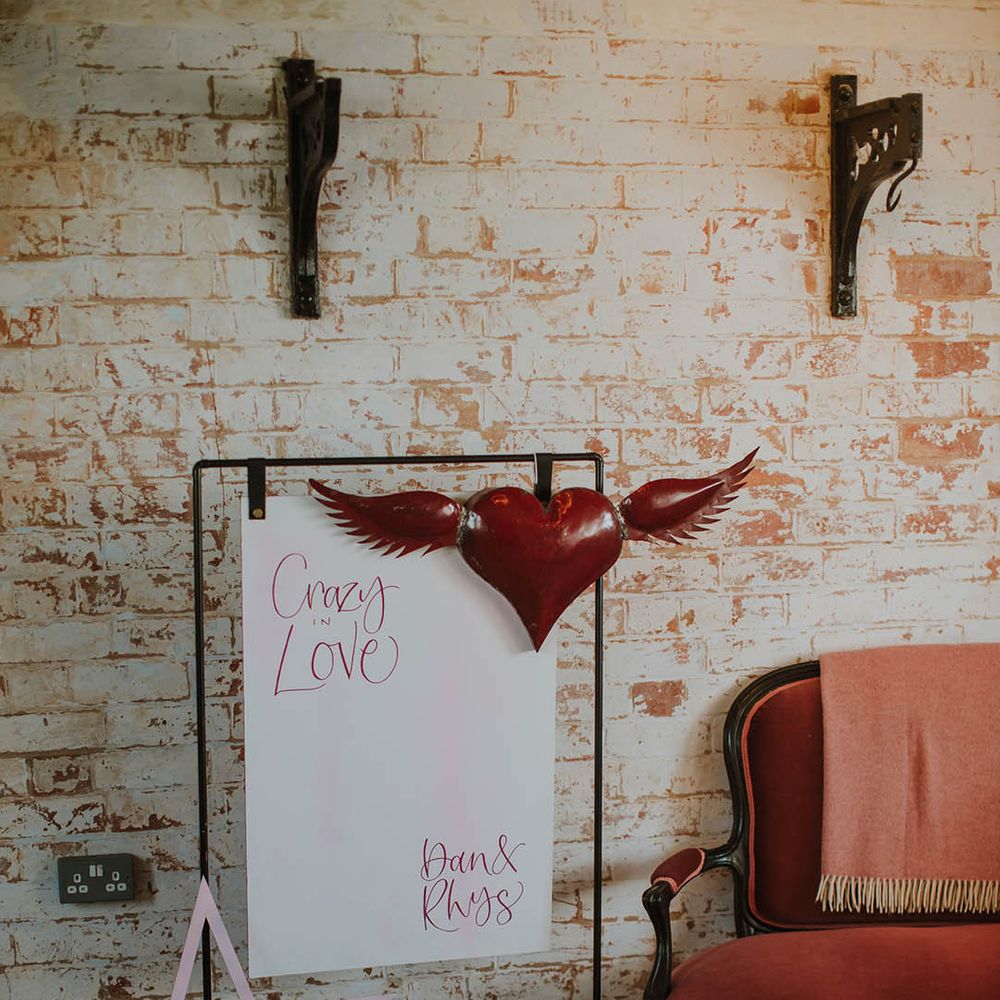 Crazy In Love wedding sign on a metal frame with red heart and giant star decor 