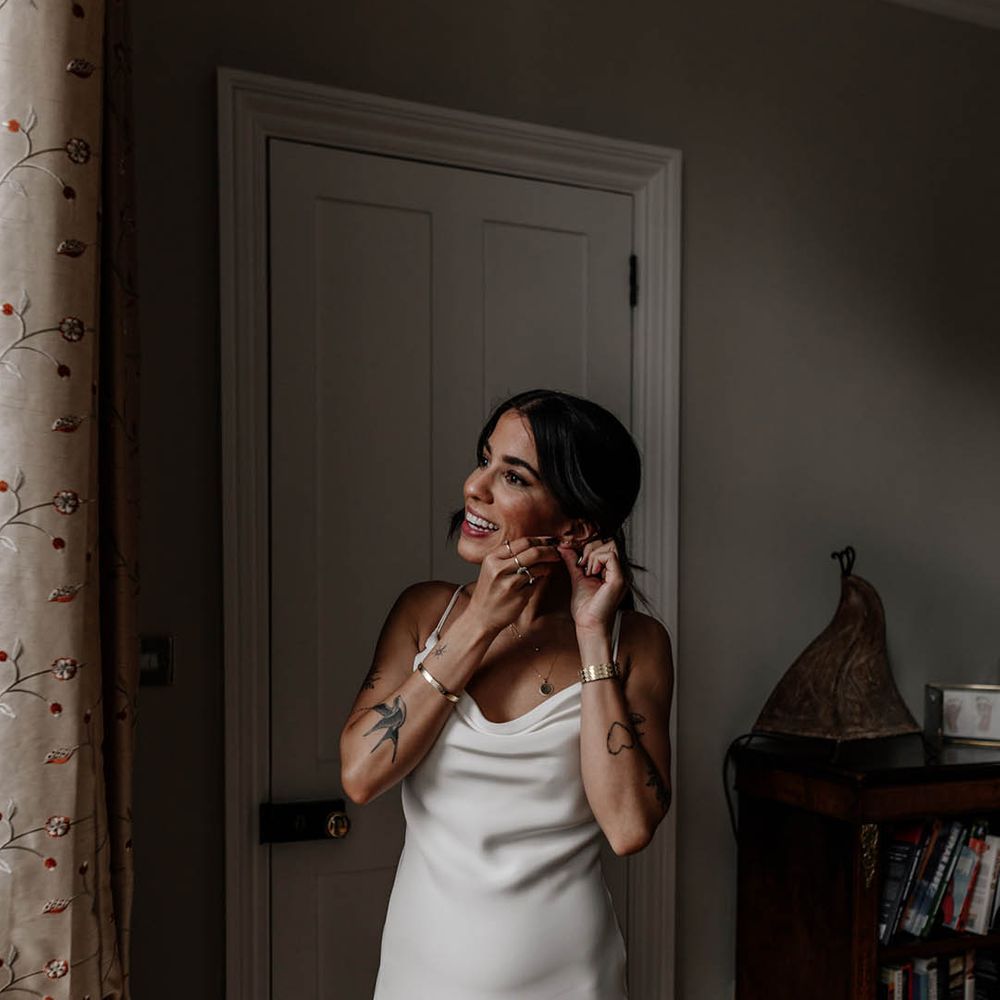 Indian bride in a satin slip wedding dress on the wedding morning 