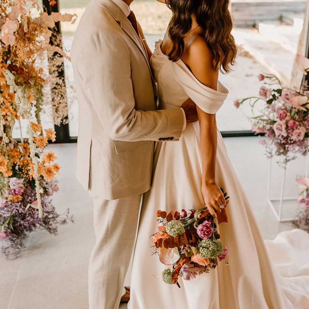 Bride and groom stand at the altar together for their autumn wedding at the Chapel House Estate