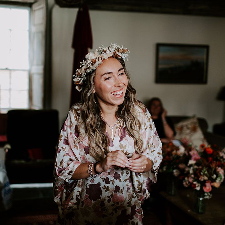 Bride wears floral crown and gets ready on the morning of her wedding day 