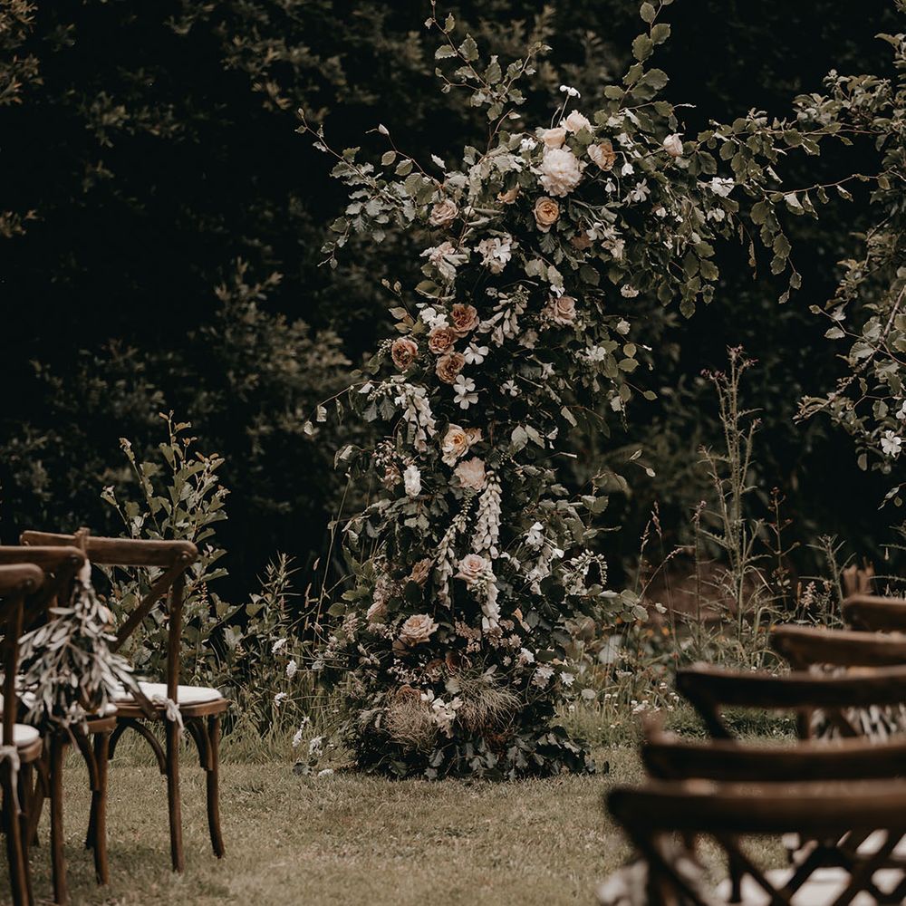 Soft pink and white wedding flower column altar decoration 