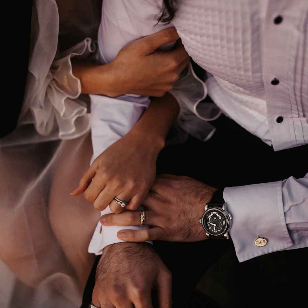 Bride and groom linking arms at Elmley Nature Reserve wedding 