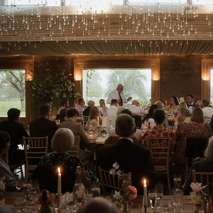 Father of the bride performs his wedding speech at the country house wedding venue 