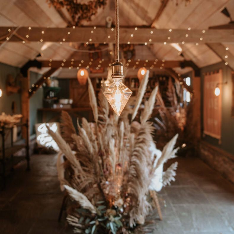 Pampas grass floral arrangement decoration inside the barn
