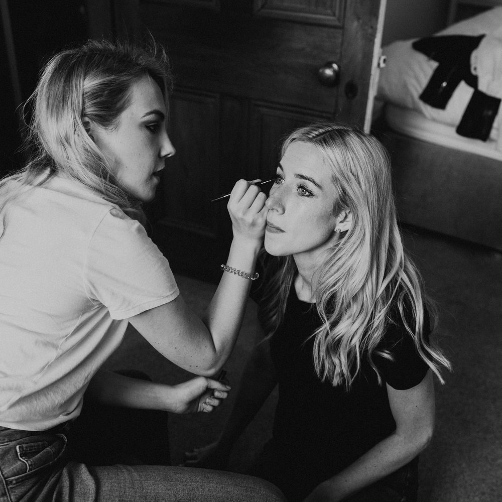 Bride has her makeup done on the morning of her wedding