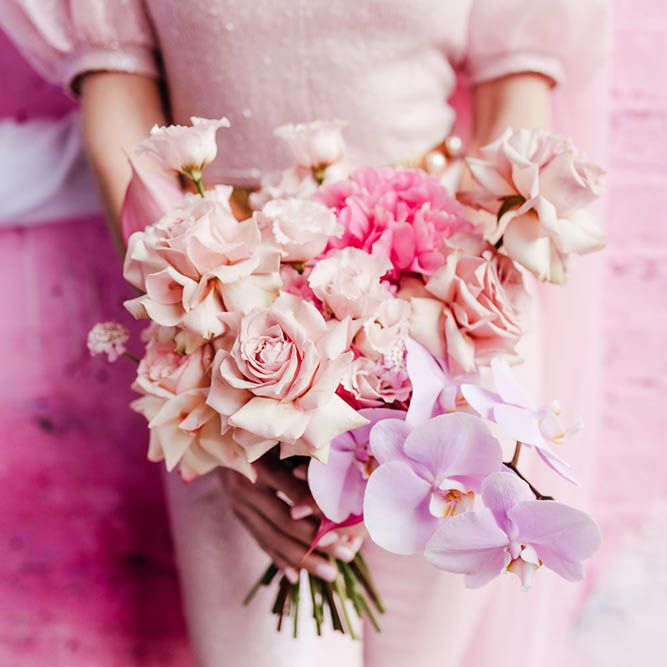 Blush pink and lilac pastel wedding bouquet with roses and orchids 