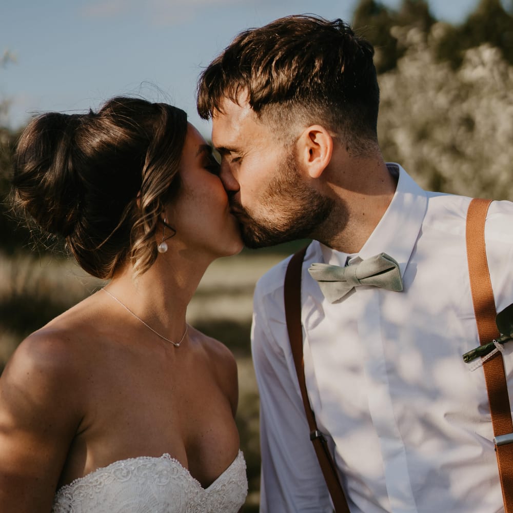 Bride & groom kiss outdoors on their wedding day | Mark Bamforth Photography