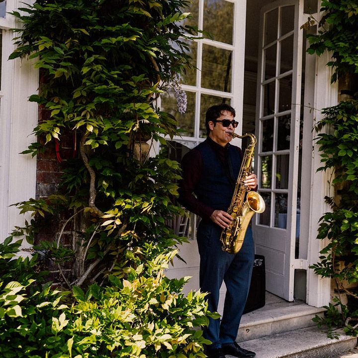Wedding entertainer plays the saxophone for traditional wedding at Goldney Hall