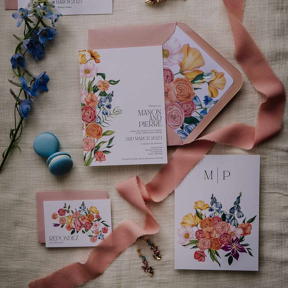 Botanical luxe wedding stationery in white and dusky pink with water colour flower designs, blue macaroons, dried foliage and gold wedding jewellery 