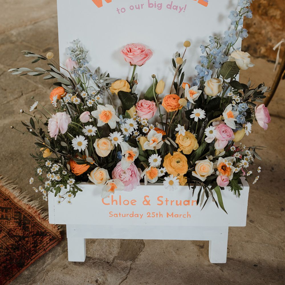 Wedding welcome sign with pastel wedding flowers for spring wedding in Scotland 