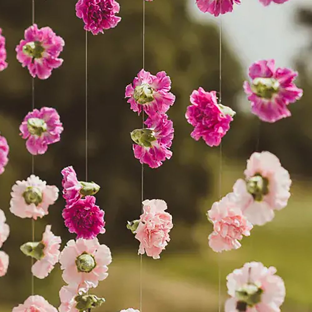 Hanging flower chain decor with pink wedding flowers by Matt Penberthy Photography 