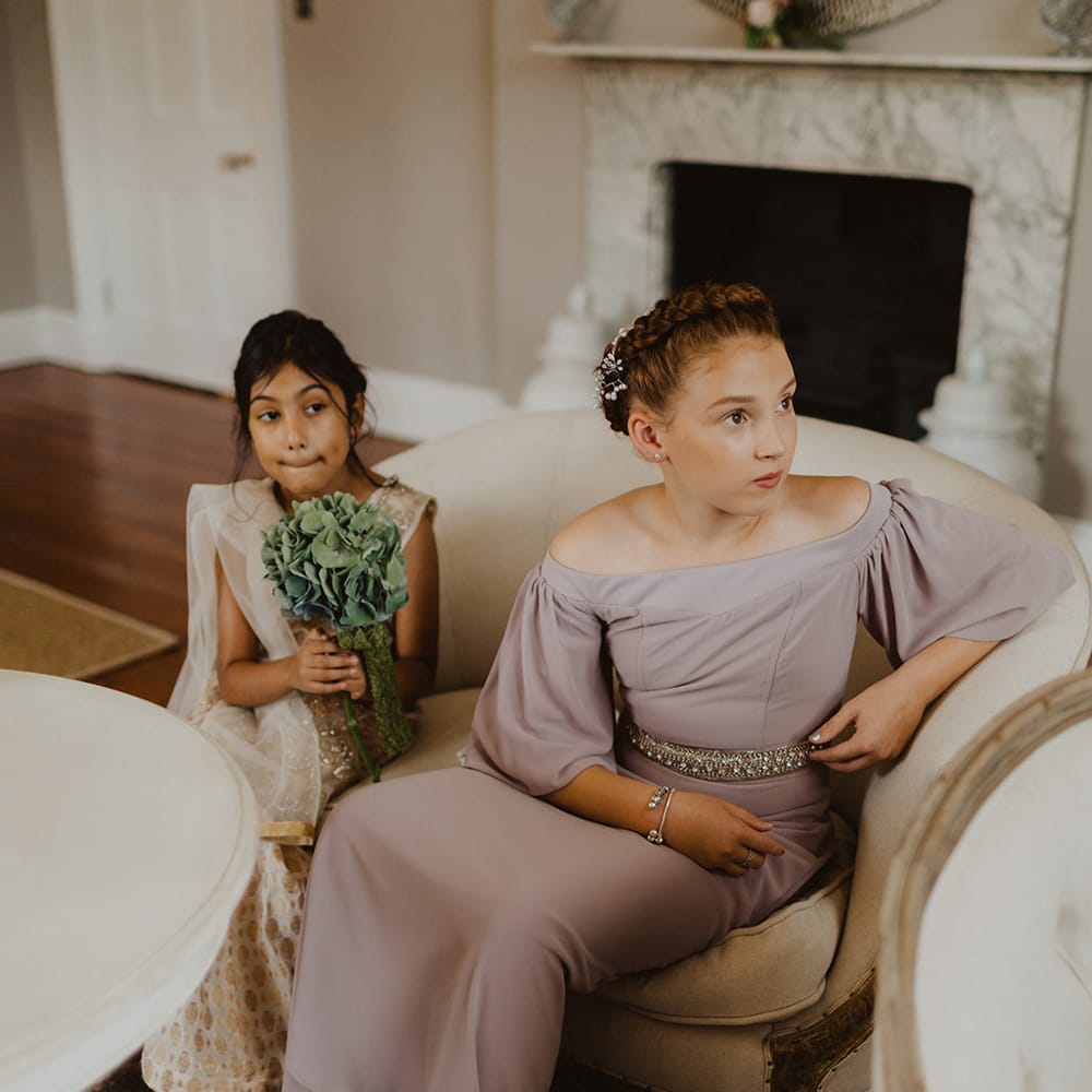 Junior bridesmaids in pastel dresses for multicultural wedding 
