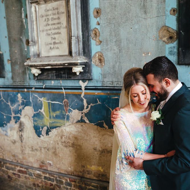 Groom kisses bride at The Asylum
