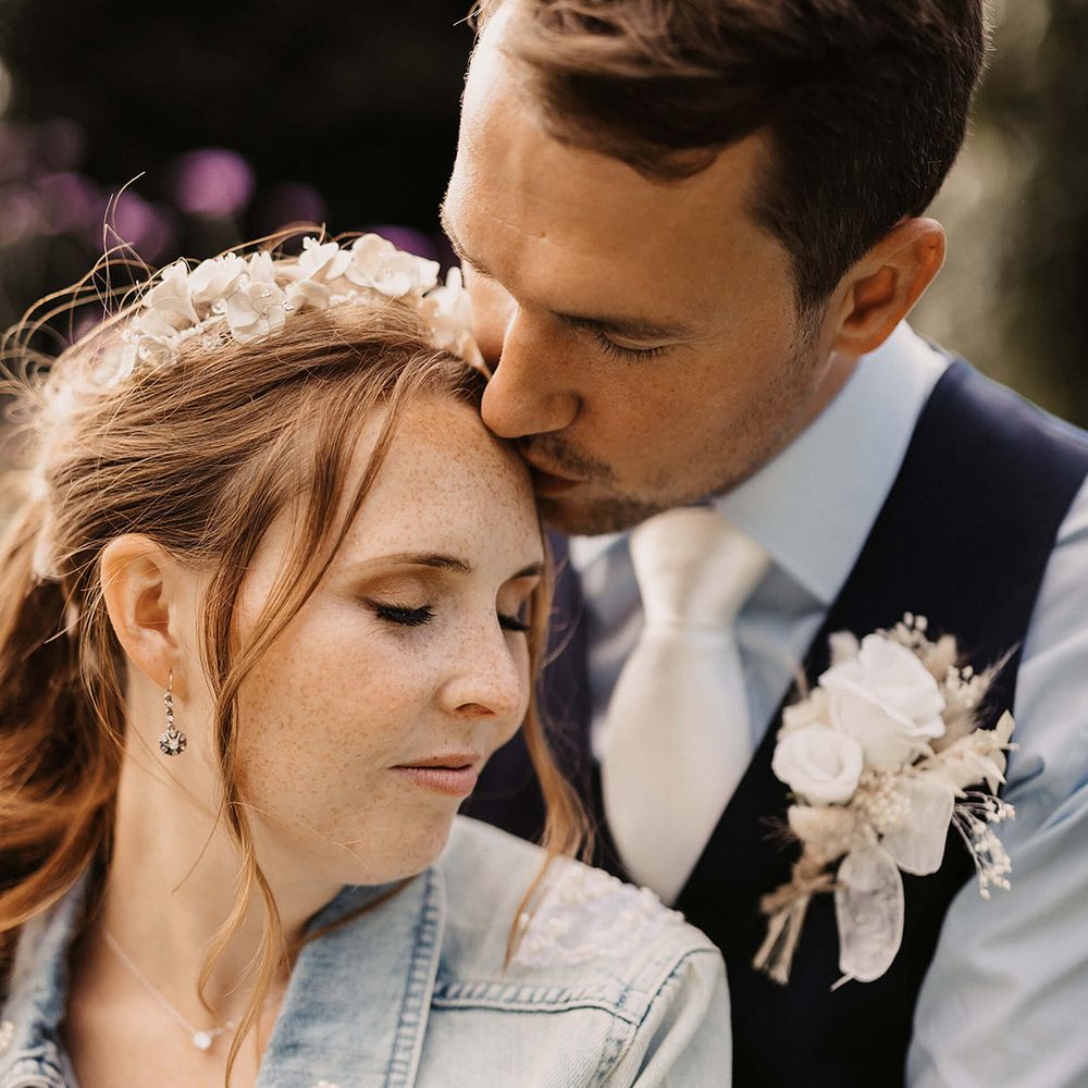 Bride leans into her groom on her wedding day