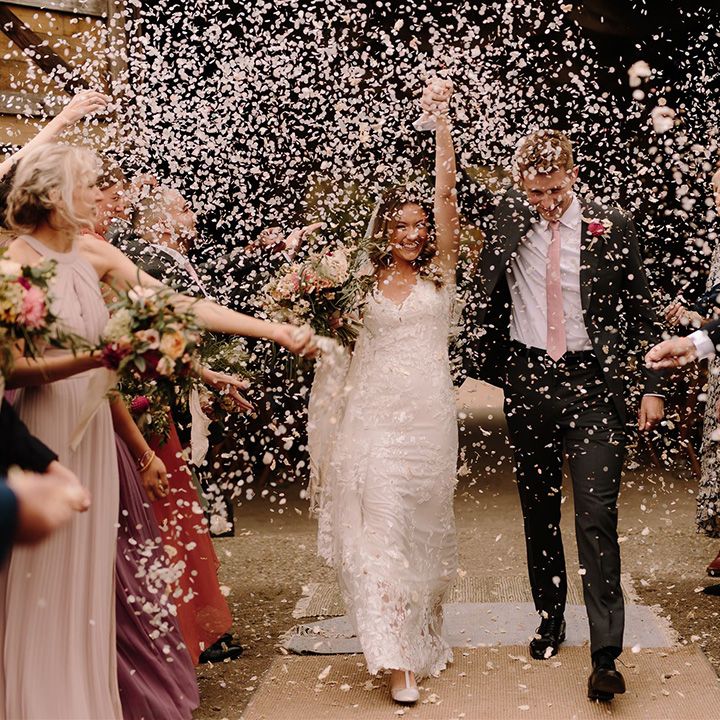 Confetti moment for bride and groom at White Pond Farm wedding venue