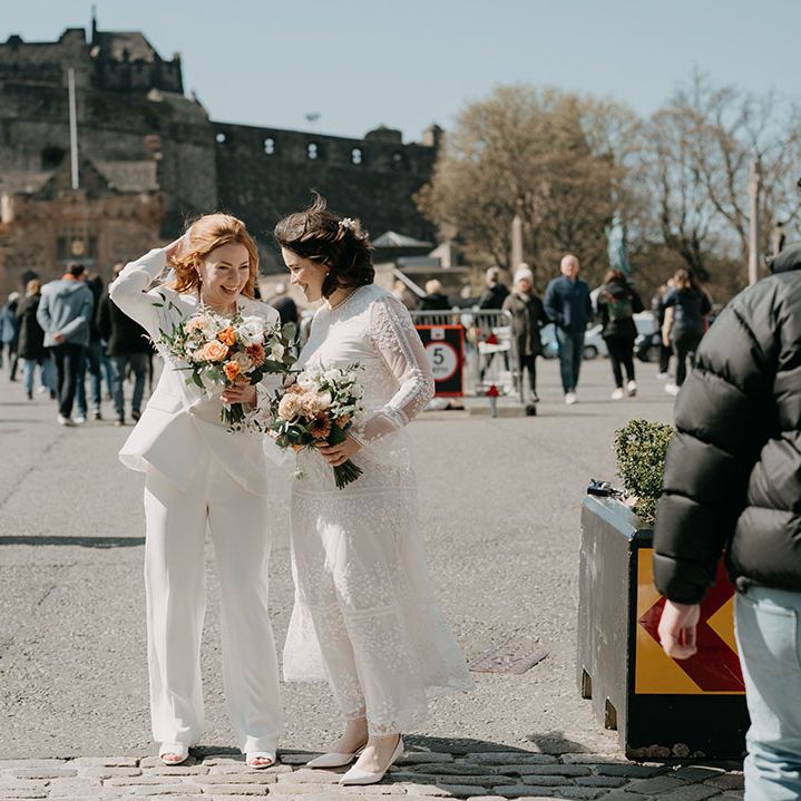 Brides stand outdoors in Edinburgh for relaxed and intimate wedding 