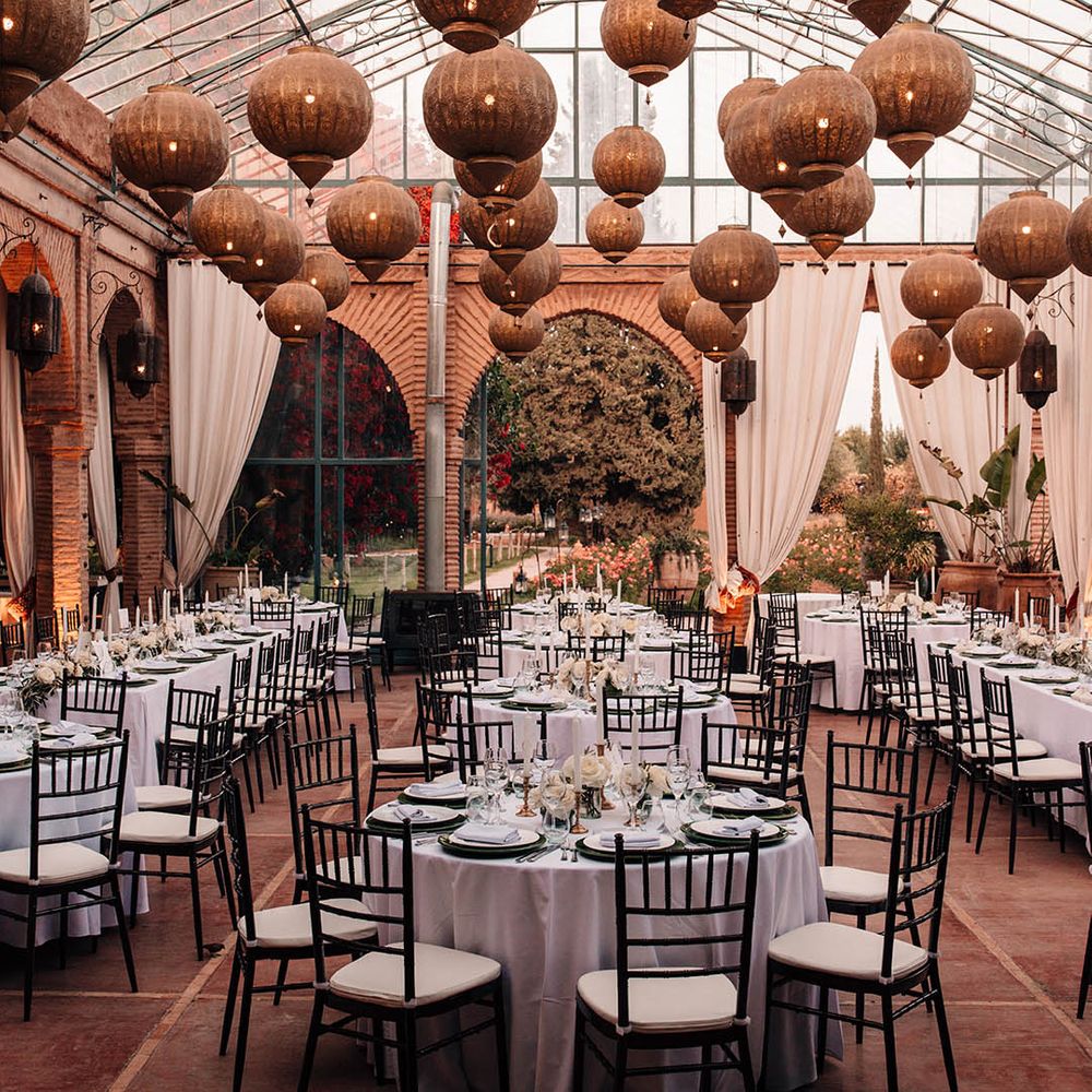Beldi Country Club wedding venue with golden lanterns and white drapery 