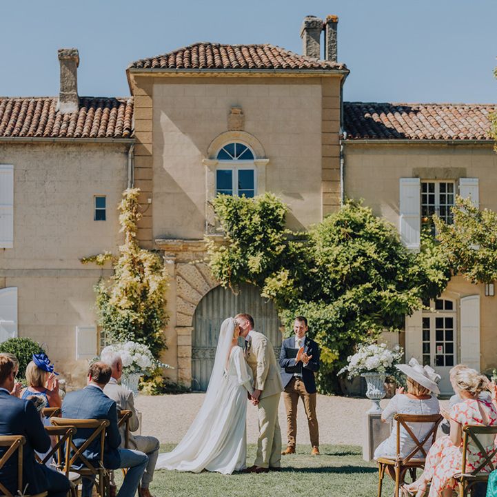 you may now kiss the bride wedding day moment at Château de Malliac