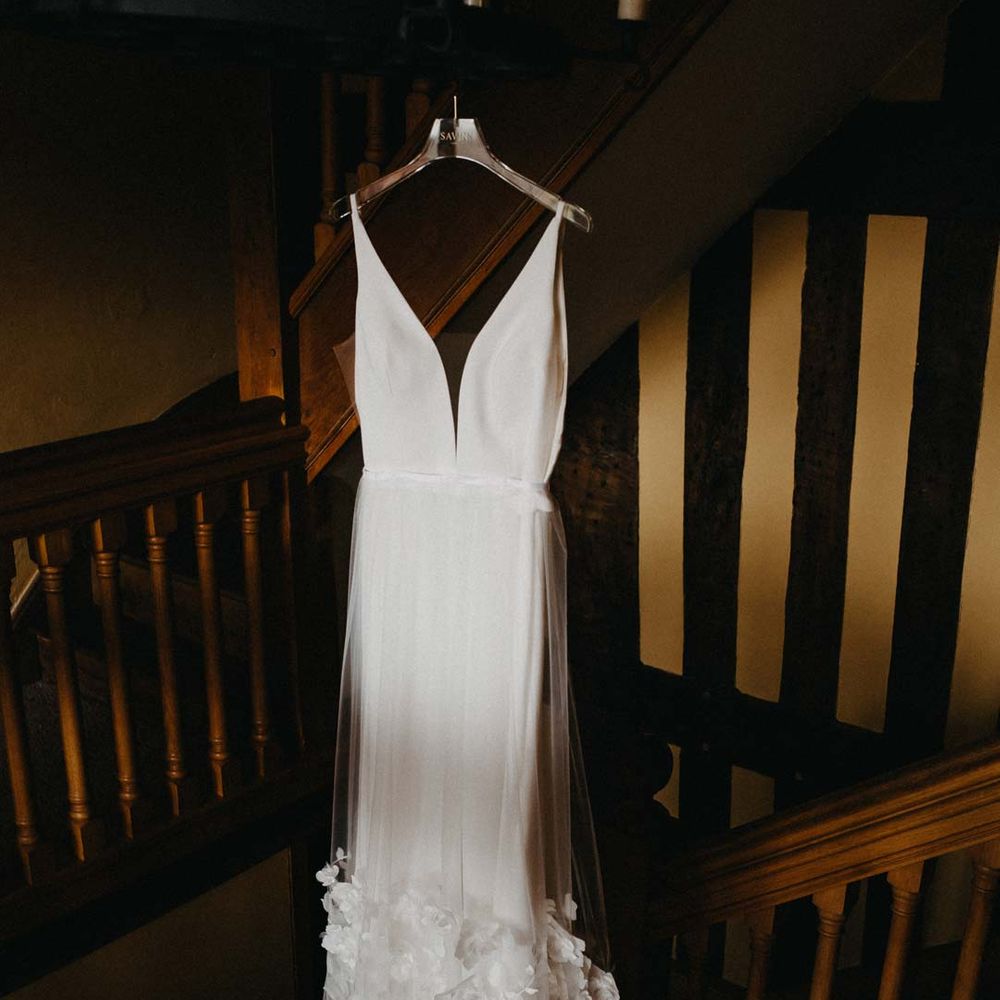 Low v neck sleeveless wedding dress with 3D floral applique train 