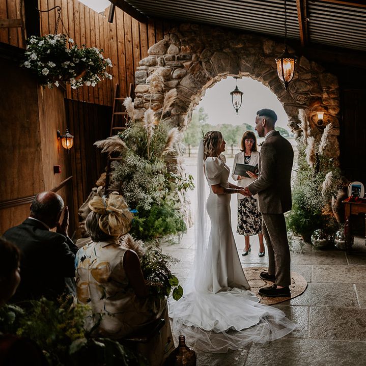 Willow Marsh Farm festival wedding for bride and groom with pampas grass flower arrangements 