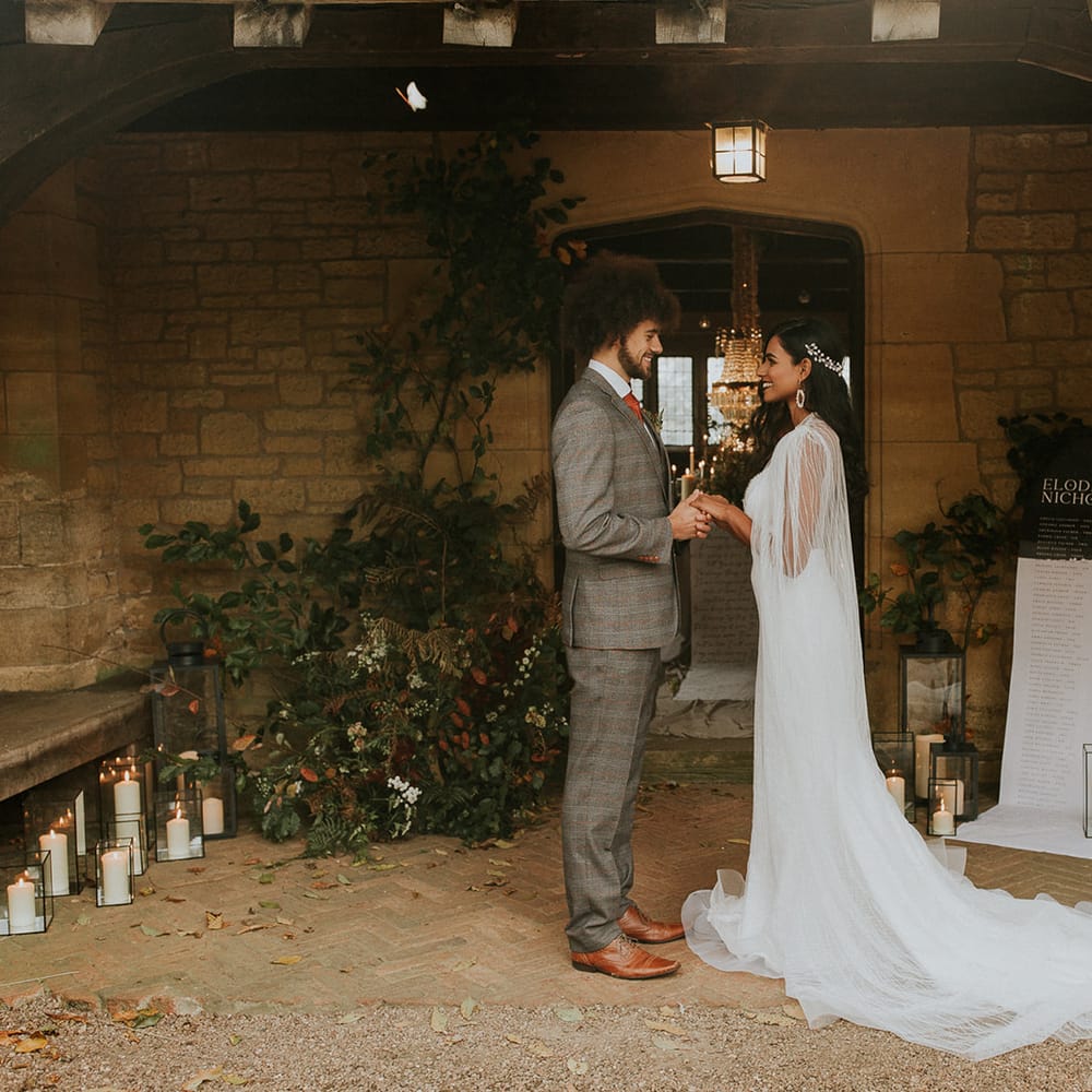 Autumn wedding ceremony decoration with foliage and lanterns 
