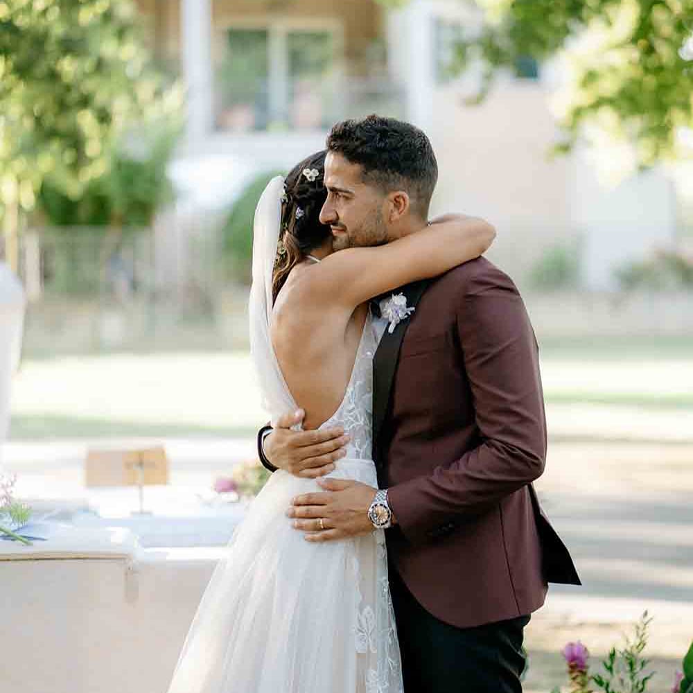 Bride and groom kiss at romantic Italian wedding