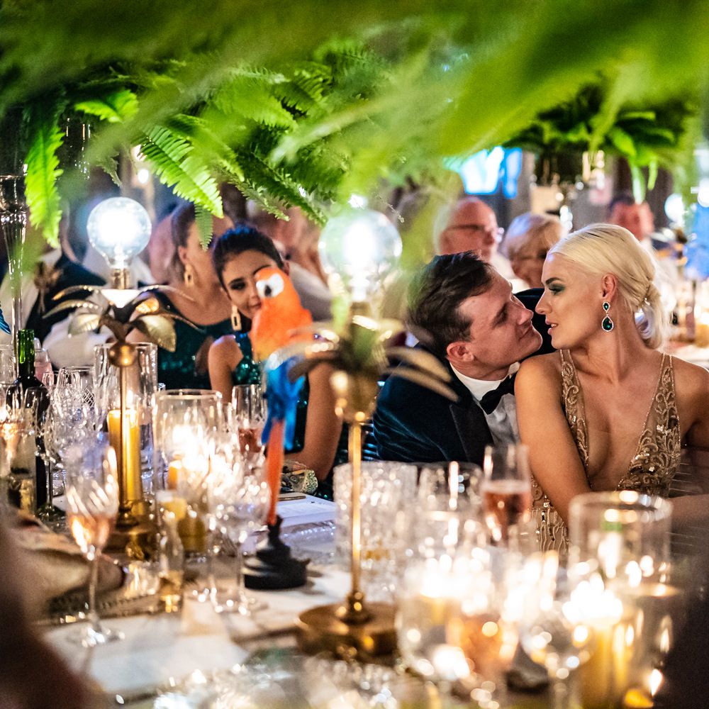 Bride and groom steal a moment during wedding breakfast
